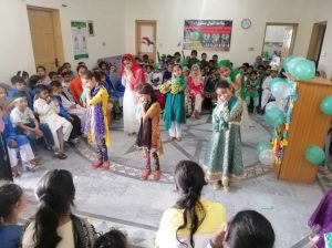 Children of AIS Islamgarh presenting a play on the independence day of Pakistan.